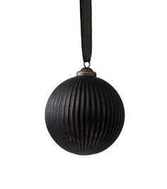 an ornament hanging from a cord on a white background