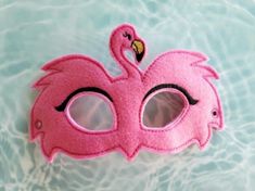 a pink mask sitting on top of a pool