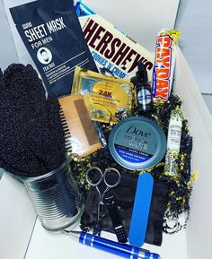 a box filled with lots of different types of hair and grooming products on top of a table