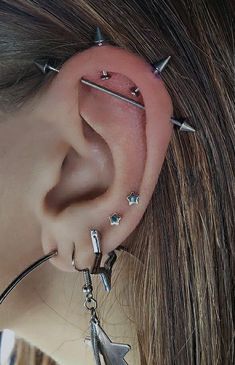 a woman with piercings on her ear