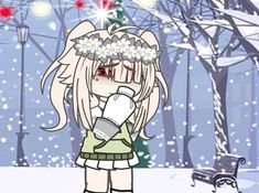 a girl standing in the snow with her arms around her head and holding a cup