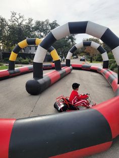 a person on a small motorcycle in an obstacle course