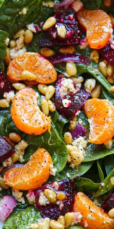 Beet Salad with Spinach, Mandarin Oranges, Red Onion, Pine Nuts, and Feta Cheese - close-up photo. Salad With Spinach, Mandarin Oranges, Pickled Beets, Salad Pasta, Lemon Vinaigrette