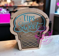 a wooden sign that says tips are sweet