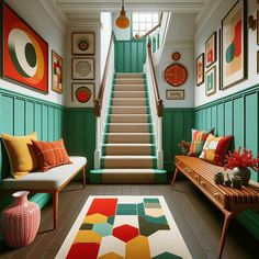 a living room filled with furniture and pictures on the wall next to a stair case