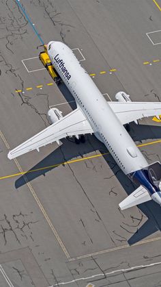 a large jetliner sitting on top of an airport tarmac