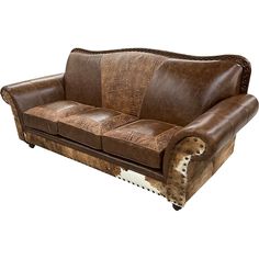 a brown leather couch with cowhide on the armrests and back cushions,