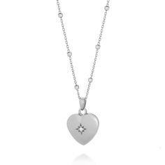 This Sterling Silver heart shaped locket is crafted from radiant silver and features a stunning starburst central design. The locket is adorned with a tiny, shimmering cubic zirconia accent that captures and reflects light,  that adds a touch of magic to any ensemble. Inside, the locket provides a special place to hold a cherished photo or keepsake. Sat on a delicate, adjustable eco silver Satellite chain, the Starlight Heart Locket is ideal for those who want to carry a piece of the night sky close to their heart. Supplied in our Nellou soft pouch and jewellery box. We want your jewellery to stay in great condition so you can enjoy it for years to come. With some simple steps you can help prolong the life of your pieces. Remove your jewellery daily, put it on as the last step when getting Sterling Silver Locket Necklace, Heart Shaped Locket, Heart Locket Necklace, Heart Locket, Silver Pieces, Necklace Sterling Silver, Sterling Silver Heart, Watch Necklace, Locket Necklace