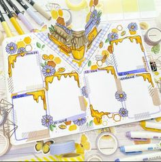 an assortment of crafting supplies including pens, scissors and paper with pictures on them