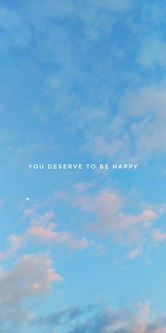 an airplane flying in the sky with a message above it that says you deserves to be happy