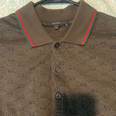 Beautiful Dark Green Gucci Polo With Green And Red Collar Trim. Size Large Very Good Condition. Gucci Polo Shirt Men, Classic Gucci Cotton Polo Shirt, Gucci Cotton Collared Polo Shirt, Gucci Polo Shirt, Gucci Short Sleeve T-shirt With Logo Print, Gucci Black T-shirt With Logo Print, Gucci Shirts, Luxury Gucci Men's T-shirt, Red Collar