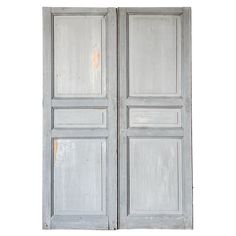 A pair of 19th-century antique French wardrobe doors. Handcrafted from solid wood, the doors feature three panels with grooved beveled trim painted in a two-tone color scheme of pale shades of blue. The doors would be best installed as intended, enclosing a built-in wardrobe or cupboard. Additionally, they would work well with sliding barn door hardware. Salvaged from a country home in France The doors are in the original two-tone pale blue paint The doors are lightweight and most likely made ou Interior Door Hardware, Homes In France, French Wardrobe, Door Gate, Sliding Barn Door Hardware, Garden Elements, Painting Trim, Wardrobe Doors, Built In Wardrobe