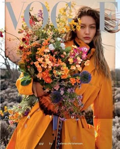 a woman holding a bouquet of flowers on the cover of a magazine