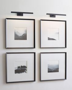 four black and white pictures hanging on the wall