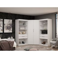 a bedroom with white furniture and brick walls