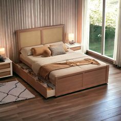 a large bed sitting on top of a wooden floor next to two nightstands and a window