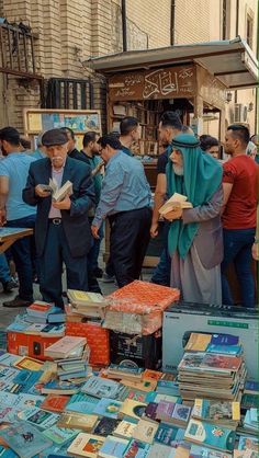 many people are looking at books on the street