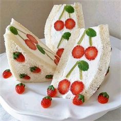 there is a piece of cake with strawberries on it and two slices cut out