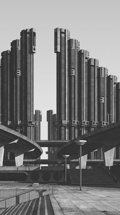 black and white photograph of an urban area with tall buildings in the backgroud