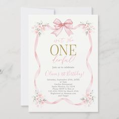 a pink and gold birthday party card with a bow on the front, it says one beautiful day