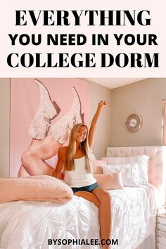 a woman sitting on her bed with the words everything you need in your college dorm