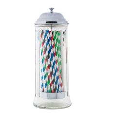 multicolored paper straws in a glass jar with silver lid on a white background