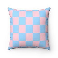 a blue and white checkered pillow on a white background