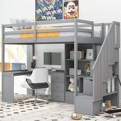 a loft bed with desk underneath it and stairs leading to the upper level, in a child's bedroom