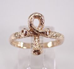 14K Yellow Gold Vintage Ankh Ring.  This ring is Solid 14KT Yellow Gold, weighs 1.9 grams and is a finger size 5 1/2, which can be resized (please inquire about sizing with the finger size you need). The Ankh in this ring measures 13.5 X 9.5 mm. I will ship this ring promptly in a gift box. ADDITIONAL REQUESTS If you would like to see more pictures of this item, please let us know and we would be happy to provide them for you. Please contact us with all questions, we are here to help. Ankh Ring, Egyptian Jewelry, Ring Unique, Rings Statement, Unique Rings, Jewelry Gift, Statement Rings, Jewelry Gifts, Jewelry Rings