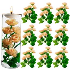 a vase filled with lots of flowers next to a candle and some green leaves in it