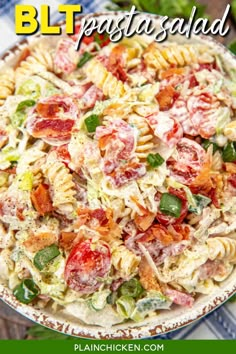 a bowl filled with pasta salad on top of a table