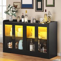 a black cabinet with yellow glass doors in a room