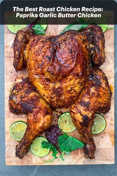 a whole chicken on a cutting board with limes