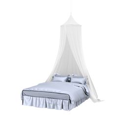 a bed with a white canopy over it and pillows on the bottom half of it