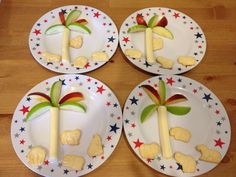 four plates with decorated palm trees on them