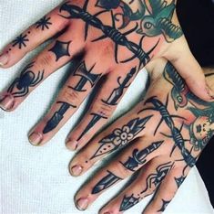 a person with many tattoos on their hands