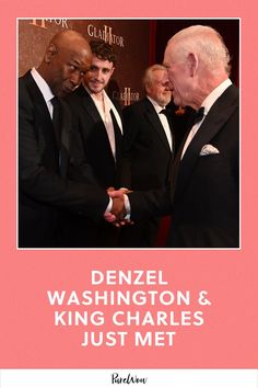 two men in suits shaking hands with another man wearing a black suit and white shirt