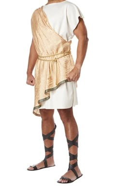 a man dressed in an ancient greek costume and gladia sandals, standing with his hands on his hips