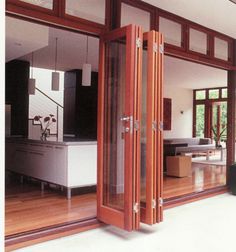 an open living room and dining area with sliding glass doors