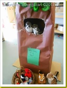 a bag with stuffed animals in it sitting on a table