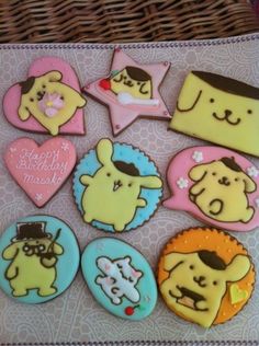 decorated cookies in the shape of dogs and hearts