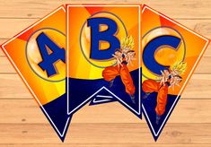 the letters abc and c are made up of colorful kites on a wooden surface