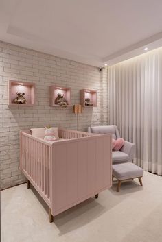 a baby's room with white brick walls and pink furniture