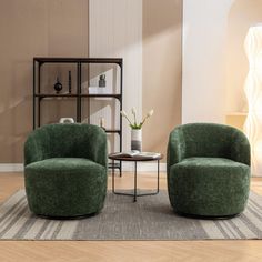 two green chairs sitting on top of a rug in a living room next to a coffee table