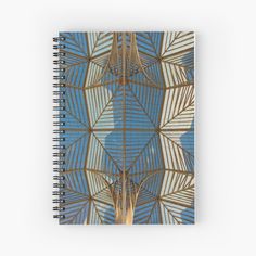 a spiral notebook with an abstract design on the cover