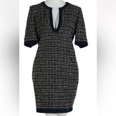 A Classic Chanel Paris French Designer Ladies Short Sleeve Tweed Sheath Dress. Features Blue Suede Leather Trim, With A V Neck Design, Lime Green, Blue And White Tweed, Accented With A Single Enameled Button At One Side Of The Dress. Made Of Wool, Silk And Lambskin. Retains Original Labels And A $3900 Price. Elegant V-neck Tweed Mini Dress, Fitted Tweed V-neck Mini Dress, Elegant Short Sleeve Tweed Mini Dress, Fitted V-neck Tweed Dress For Formal Occasions, Fitted Tweed V-neck Dress, Elegant Tweed V-neck Dress, Elegant Blue Tweed Dress, Elegant Blue Tweed Dress For Formal Occasions, Chanel Sweater Dress