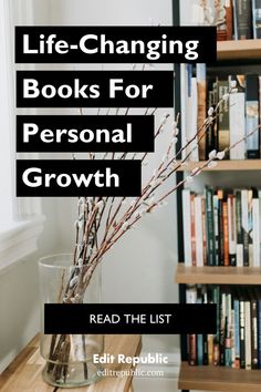 a vase filled with branches sitting on top of a table next to a book shelf