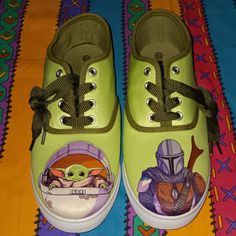 a pair of green shoes with star wars images on them