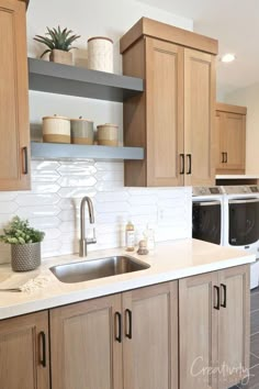 a kitchen with wooden cabinets and white counter tops