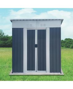 an outdoor storage shed in the middle of a field